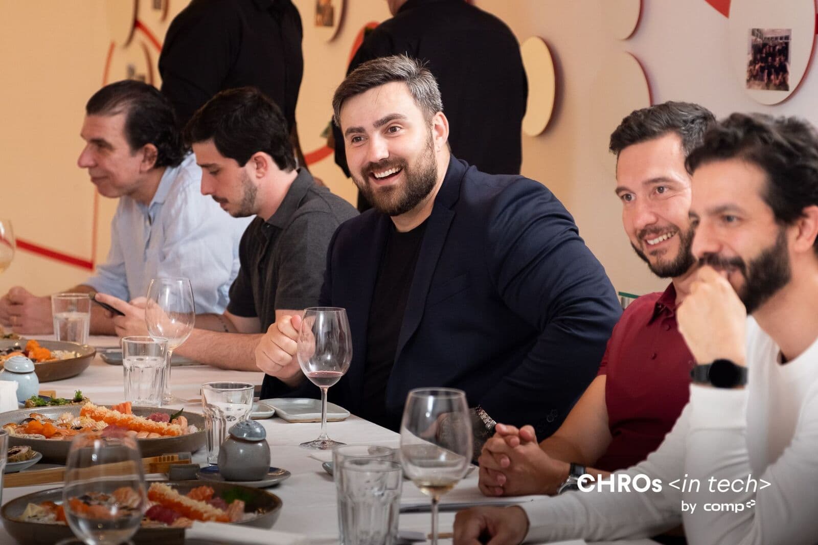 Members at the table during the community dinner