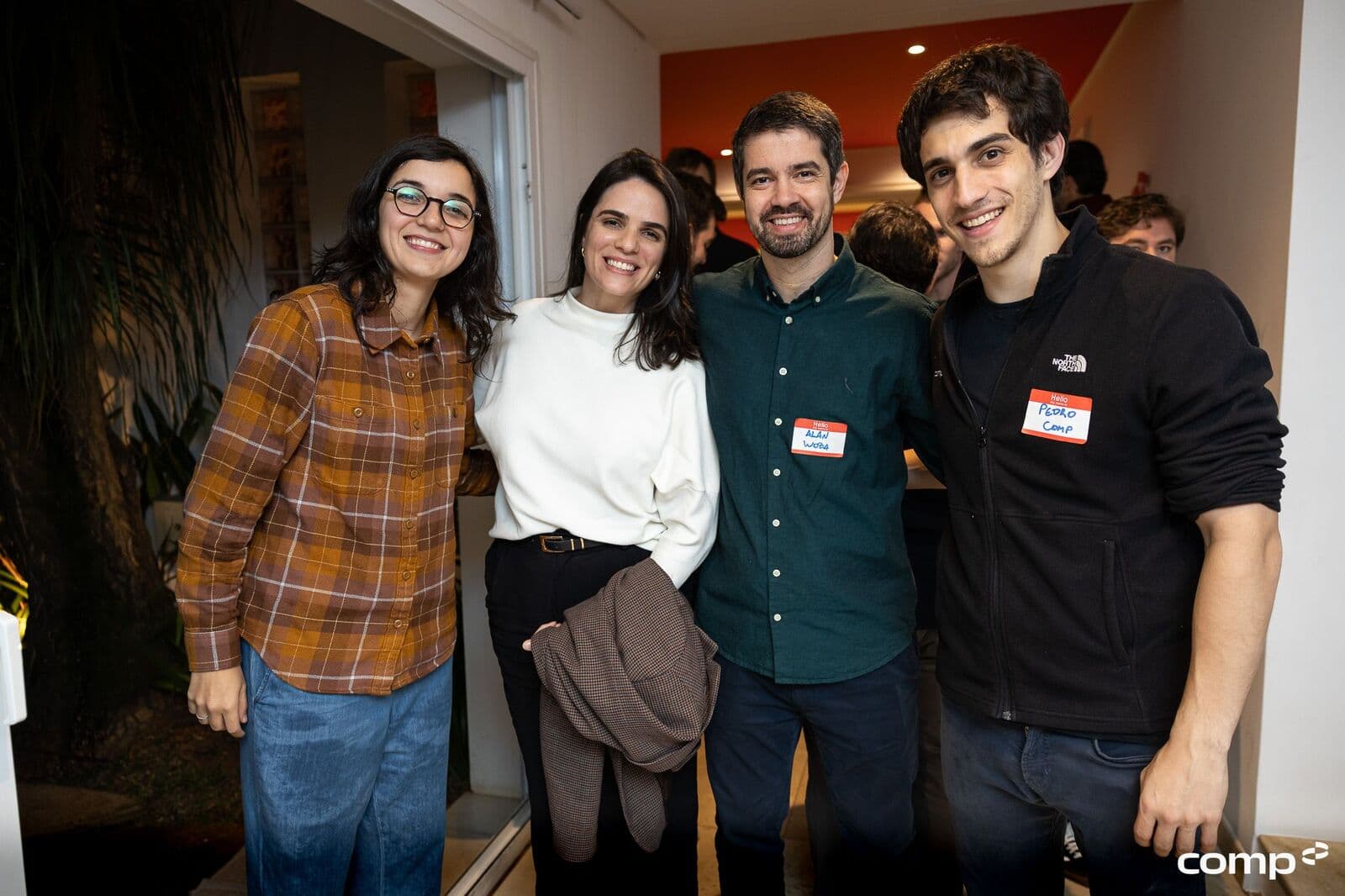 Four participants posing at the community dinner